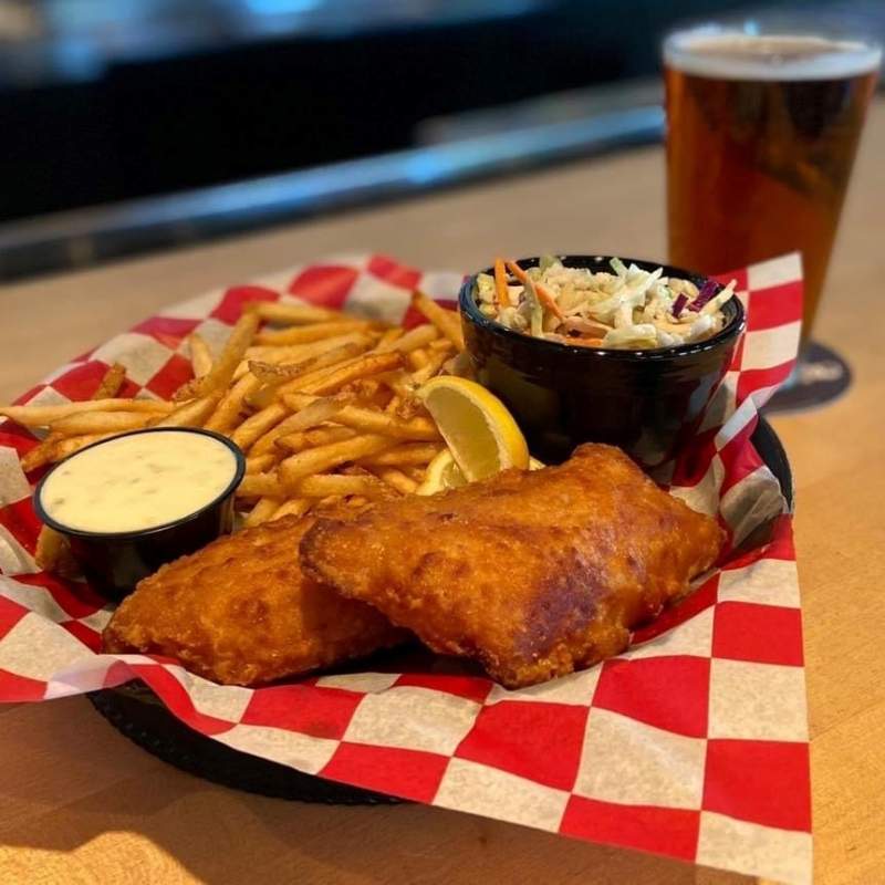 Enjoy dinner and life music at Top Dawg Tavern